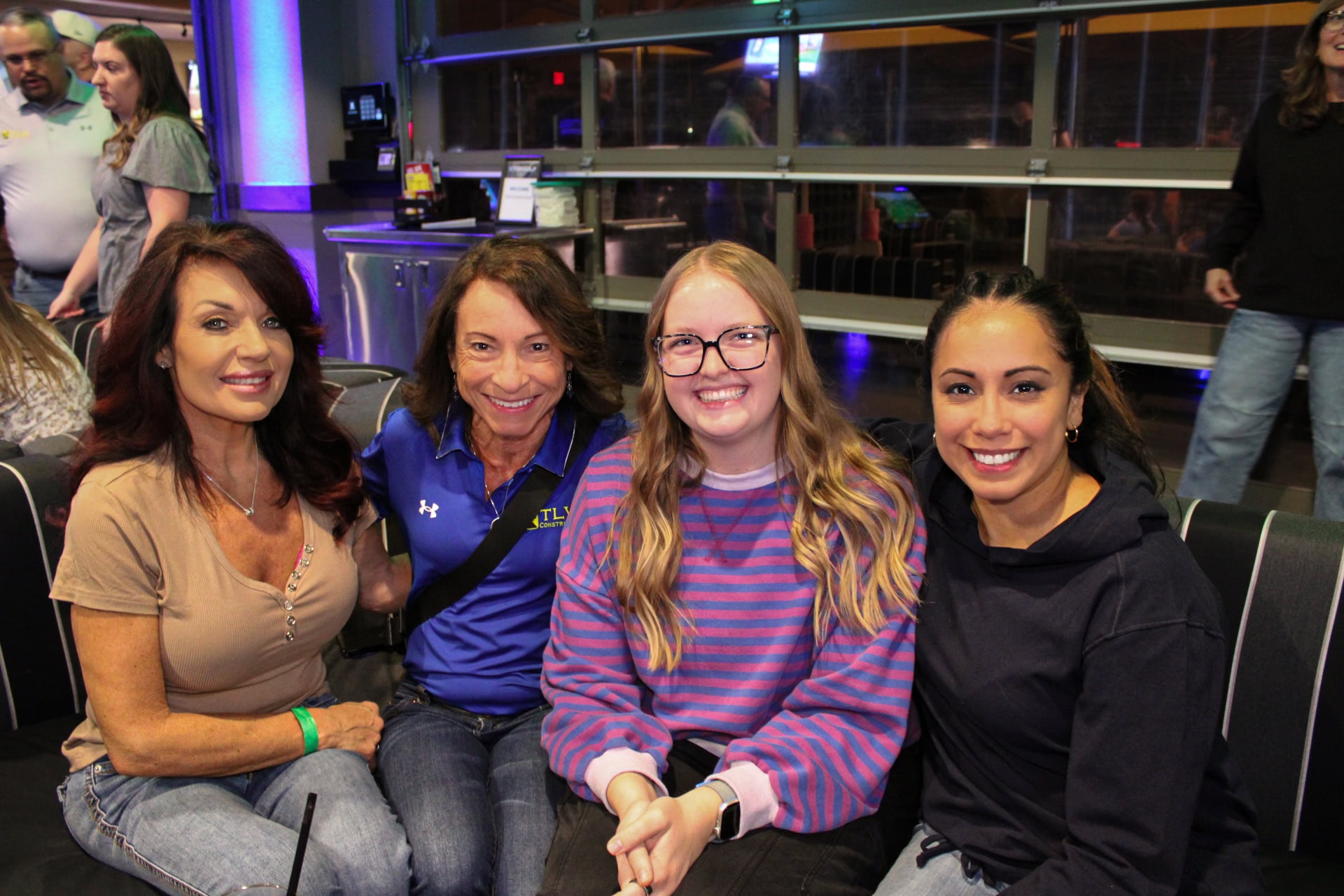Group of women enjoying a team-building event at Topgolf Scottsdale.